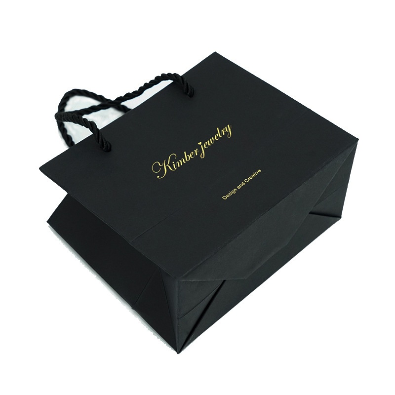 Shopping paper bag with rope handles for clothing packaging